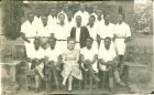 Prof Christopher Ndugwa during his college years.<br />Prof Ndugwa (back row, wearing glasses, behind Nsibambi). He was the one of the still surviving Trojans in this picture taken in 1952 (infront of The Kings College Budo near the  Old Chapel). Others in the photo include Prof Nsibambi, HM Kyanda (first Uganda KCB HM), David Barlow, Dr. Magambo, David Sekade, John Sevume , teacher Anne Kannie